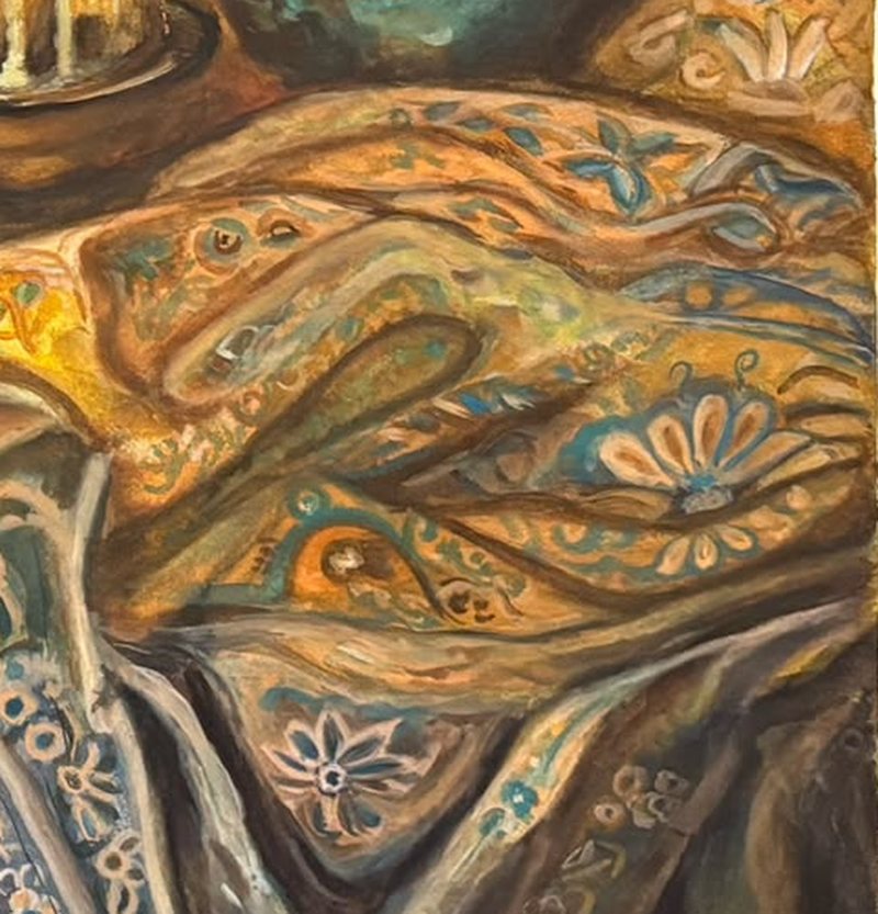 Detail: folds of the shawl painted with paisley shapes and pale blue flowers over warm ochre